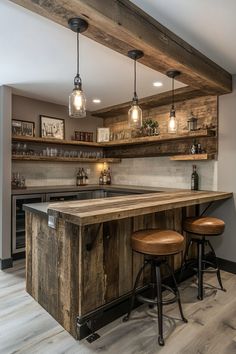 a kitchen with two stools next to an island