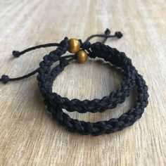 "These lovely bracelets are made with hemp cord. Designed for couples. The \"Hers\" bracelet is color black and closes to around 6\"inches. It opens to around 9\" inches. The \"His\" bracelet is color black and closes to around 7\" inches. It opens to around 10\" These bracelets are perfect for couples. Includes Gift Box Please feel free to contact me if you have any questions." Handmade Black Braided Friendship Bracelets, Black Bohemian Braided Bracelets For Everyday, Black Macrame Braided Bracelet As Gift, Black Macrame Braided Bracelet For Gift, Black Macrame Friendship Bracelets As Gift, Black Macrame Jewelry For Friendship, Black Spiritual Friendship Bracelets With Adjustable Cord, Spiritual Black Braided Bracelets For Friendship, Black Spiritual Friendship Bracelet With Adjustable Cord