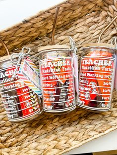 three glass jars filled with fruit sitting on top of a wicker basket