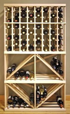 a wooden wine rack filled with lots of bottles