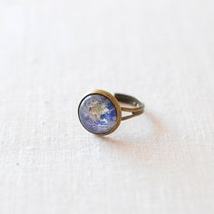 Planet Earth Ring. i just love it. Earth Rings, Planet Earth From Space, Earth Ring, Cowboy Jewelry, Cosmic Jewelry, Western Rings, Planet Ring, Space Rings, The Planet Earth