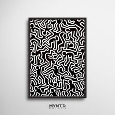 an abstract black and white painting on a wall with the word myntd in it