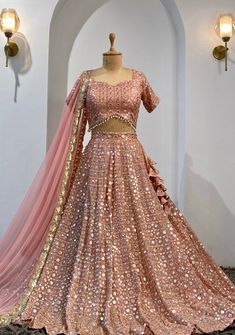 Made to Order/Measurement/Custom Order Lehenga - Color : Dusty pink  - Fabric : Mirror work Georgette - Fully flared paneled lehenga - Embroidered  Blouse -  Net Dupatta with Gold Border - Drawstring closure with Tassels - - It can be customize in any design or size  PLEASE NOTE: BUYERS ARE RESPONSIBLE FOR ANY CUSTOMS AND IMPORT TAXES THAT MAY APPLY. This is a made to order product. If you opt for 'Made To Measurement Option', we will provide a measurement template and you can share the measurem Fabric Mirror, Peach Lehenga, Floral Lehenga, Lengha Choli, Blouse Silk, Indian Lehenga, Pink Mirror, Wedding Lehenga