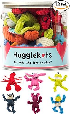 a can filled with lots of colorful stuffed animals in it's lid and the words huglekts for cats who love to play