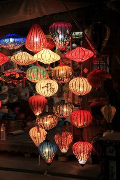 many red and white lanterns hanging from the ceiling