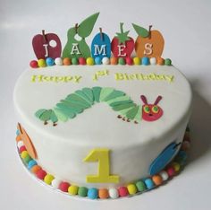 a birthday cake with the number one on it for a child's first birthday