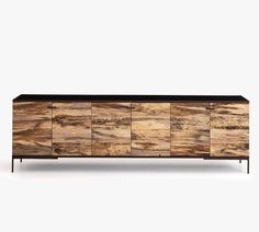 the sideboard is made out of wood and has black metal legs, which are accented with wooden panels