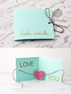 two folded cards with the words love inside and one has a pink heart on it