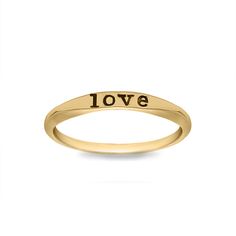 a gold plated ring with the word kate engraved in black ink on it's side