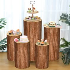 three tiered cake stands with cupcakes on them