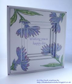 a greeting card with blue flowers and green leaves on the front, which reads wishing you a happy day