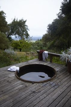 an outdoor hot tub on a wooden deck