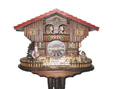 a large wooden cuckoo clock with figures on it