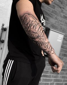 a man with a tattoo on his arm