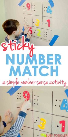 a child is playing with numbers on the wall