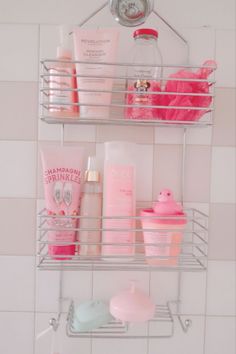 two metal shelves filled with different types of beauty products on top of a tiled wall