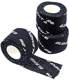 three rolls of black cloth tape with white letters on them and one roll is rolled up