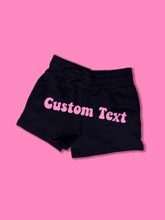 Custom Text Fleece Shorts | Cute Booty Shorts | Y2K Shorts | Cute Shorts | Funny Shorts | Warm Fleece Shorts | Lounge Shorts | Comfy Shorts to Lounge in! Actual item may be lighter/darker than pictured. M A T E R I A L S - 57% Cotton / 38% Polyester / 5% Spandex - Adjustable Drawstring Waistband - High Waisted - Two Side Pockets S I Z I N G - Size chart is available on our listing photos. S H I P P I N G  &  P R O D U C T I O N  T I M E - Production Time is 2-3 Business Days. (May be delayed dur Leisure Short Pants With Built-in Shorts, Black Bottoms With Letter Print, Short Length, Black Bottoms With Letter Print Short Length, Black Bottoms With Letter Print In Short Length, Black Short Bottoms With Letter Print, Black Bottoms With Letter Print, Black Short Length Bottoms With Letter Print, Athleisure Shorts With Letter Print For Leisure, Leisure Letter Print Short Bottoms