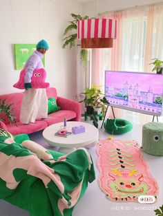 a person standing on top of a pink couch in a living room next to a flat screen tv