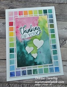 a card with the words thinking of you written on it and two hearts cut out