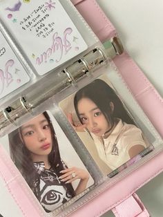 an open pink case with two pictures on the front and one in the back that is attached to it