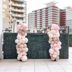 two tall balloons are placed on the ground