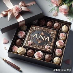 a box filled with assorted chocolates next to flowers