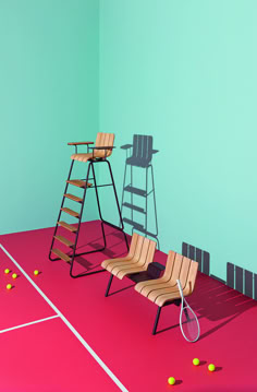 a tennis court with chairs and rackets on it, in front of a green wall