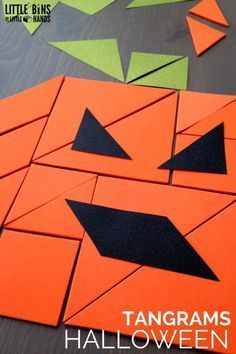 an orange and black paper cut out to look like pumpkins with text that reads tangrams halloween