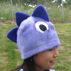 "If you love dinsoaurs, you'll love this Dino fleece hat. It's fun, warm and cozy to wear for winter and for Halloween. This hat is made with Lavender tie-dye fleece with three 3-D spikes in contrast color on top of the hat. This hat is for boys, girls and adults too (L). This hat is machine washable...just turn the hat inside out when launder.  Please also check out this dino hat in blue and green color. Sizes available: XS(18\"), M(20\"), L(22\") Machine wash cold with like colors. Gentle cycl Dino Hat, Dinosaur Hat, Kids Winter Hats, Kids Purse, Clothing Projects, Toddler Bibs, White Beanies, Brown Teddy Bear, Fleece Hat