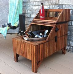 an old fashioned wooden cabinet with bottles in it