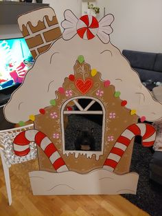 a dog in a gingerbread house made out of cardboard