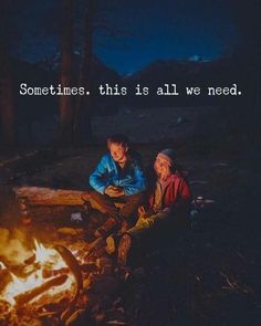 two people sitting around a campfire with the caption sometimes, this is all we need