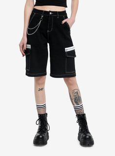 Long shorts have returned! This black denim pair has white contrast stitching  a removable waist chain  cargo pockets and faux zippers. Shoes For Shorts, Alt Short Outfits, Black Long Shorts, Long Black Shorts, Punk Style High Waist Shorts With Pockets, Shorts Fashion, Goth Outfits With Shorts, Punk Style Bottoms With Pockets, Short Length, Black Bottoms With Built-in Shorts For Alternative Fashion