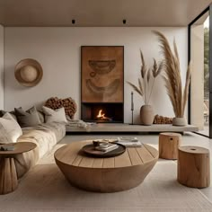 a living room filled with furniture and a fire place in the middle of the room