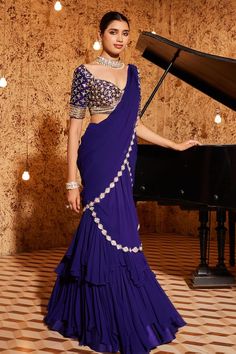 Purple pre-draped mermaid saree with sequin embroidered cut-out border and draped tiered hemline. Comes with embroidered padded blouse. - Aza Fashions Purple Drapes, Blue Outfits, Drape Saree, Ready To Wear Saree, Indian Wedding Wear, Half Sleeve Blouse, Saree Dress, Saree Look, Indian Fashion Dresses