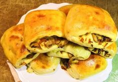 some food that is sitting on a white plate with a green and white towel next to it