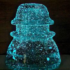 a large glass vase with blue lights on it