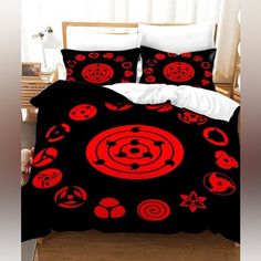 a bed with red and black designs on it