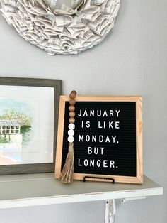 a sign that says january is like monday but longer on the shelf next to it