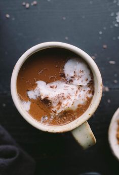 two mugs filled with different types of food