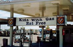 a gas station with signs for kids with gas