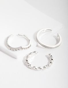 Toe rings are the perfect accessory if you like the beach and soaking up the sun! This pack comes with 3 adjustable open toe rings in a diamante and ridged silver-toned design. Stylish from head to toe! 

Composition: Silver-toned ring with enamel details
Colour: Silver
Style: Wear with your favourite summer outfit to hit the beach
Occasion: Soaking up the sun with friends
Care: Avoid direct contact with water, moisturisers and perfumes. Hinged Ring, Fashion Jewellery Online, Sleeper Earrings, Flat Back Earrings, Bold Earrings, Toe Ring, Silver Style, Glam Fashion, Body Jewellery