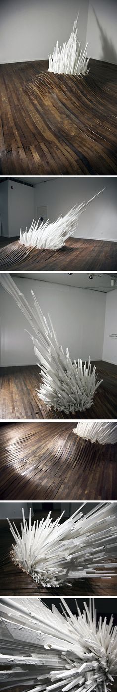 white feathers floating on top of a wooden table