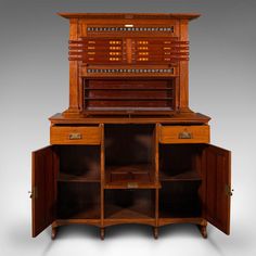 an old fashioned wooden cabinet with many drawers