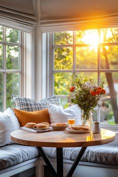 the sun shines brightly through the windows in this living room with white couches and pillows