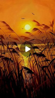 the sun is setting over water with tall grass