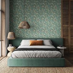 a bedroom with green wallpaper and a bed in the middle, surrounded by wooden shutters