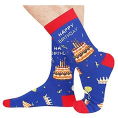 happy birthday socks for men with cake and candles on them, both wearing blue socks