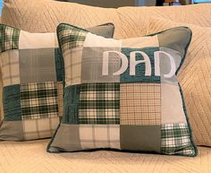 two pillows with the words dad on them